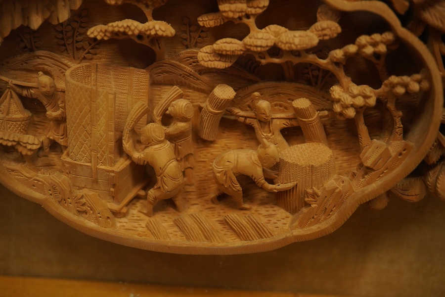 A pair of early 20th century, finely carved Chinese sandalwood photo frames, 30.5cmx24cm oval. Condition - good